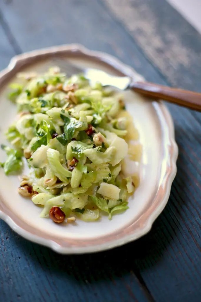 celery salad on a white plate