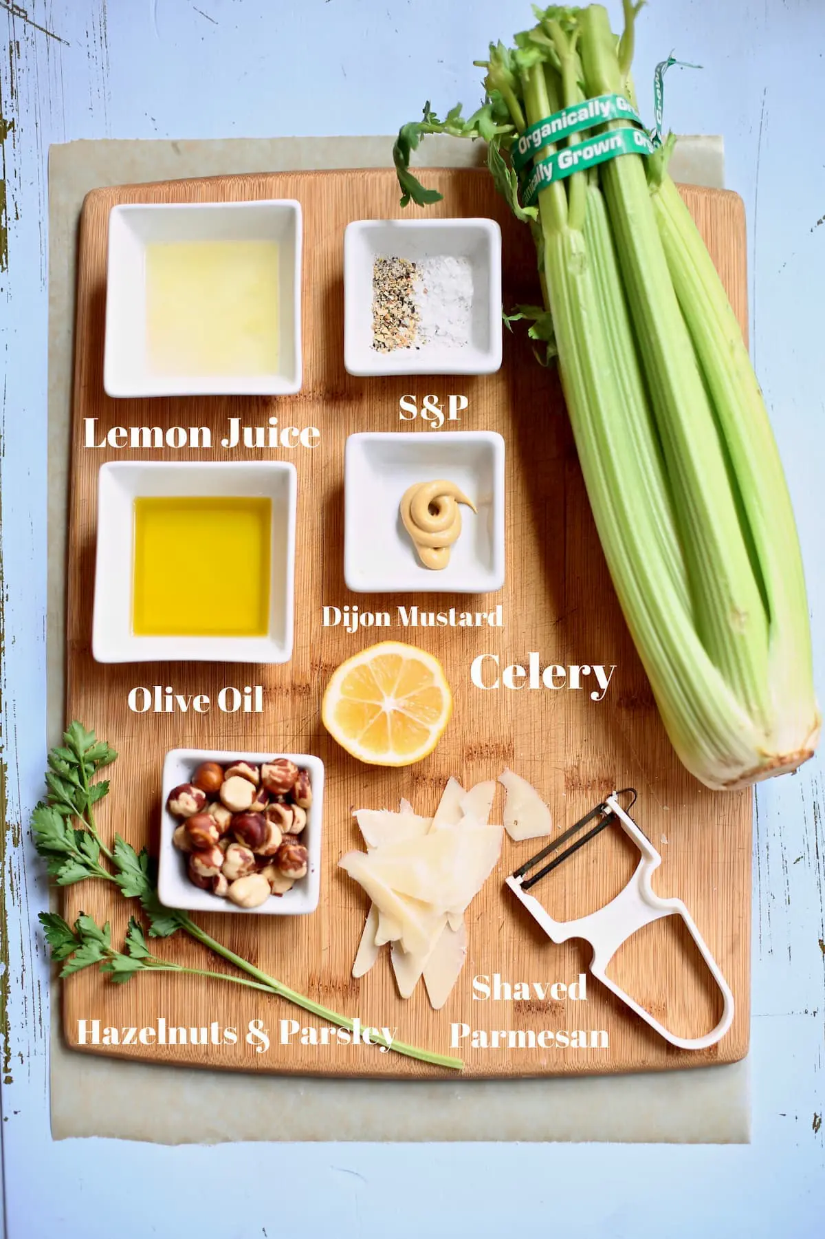 ingredients for salad on a wooden cutting board 