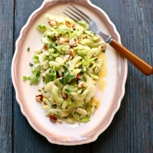 an overhead photo of a platter with celery salad on it.