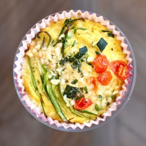 a square photo of a vegetable frittata.