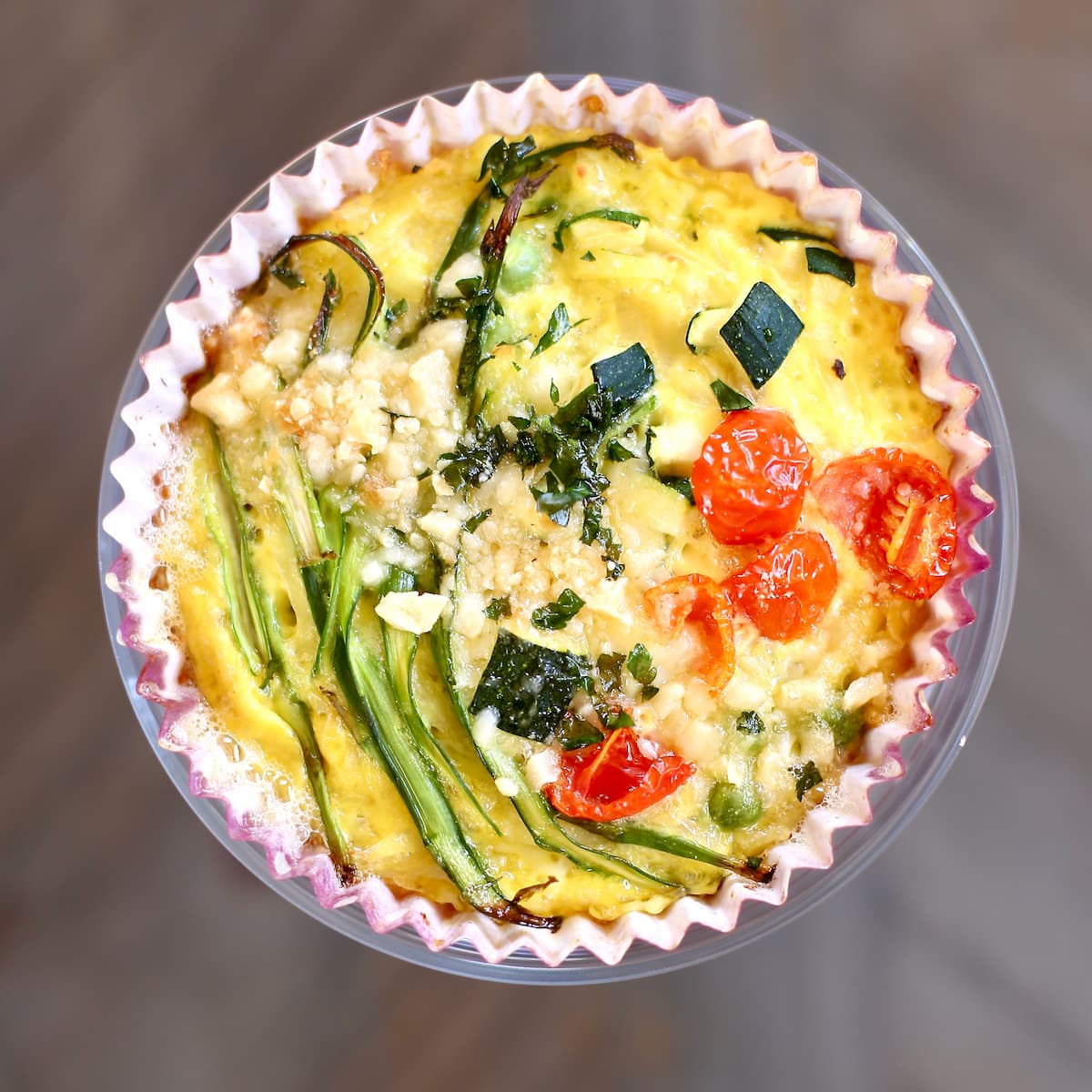 a square photo of a vegetable frittata.