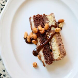 a square overhead photo of ice cream cake on a white plate.