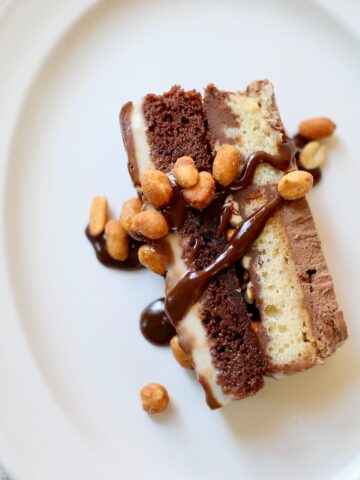 a square overhead photo of ice cream cake on a white plate.