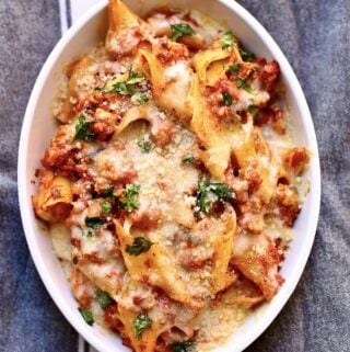 baked pasta in a white casserole dish on a gray table