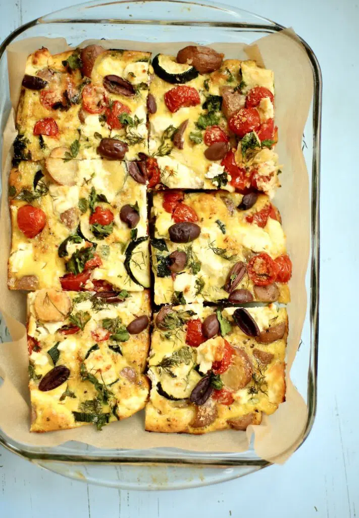 cooked frittata sliced in the baking pan.