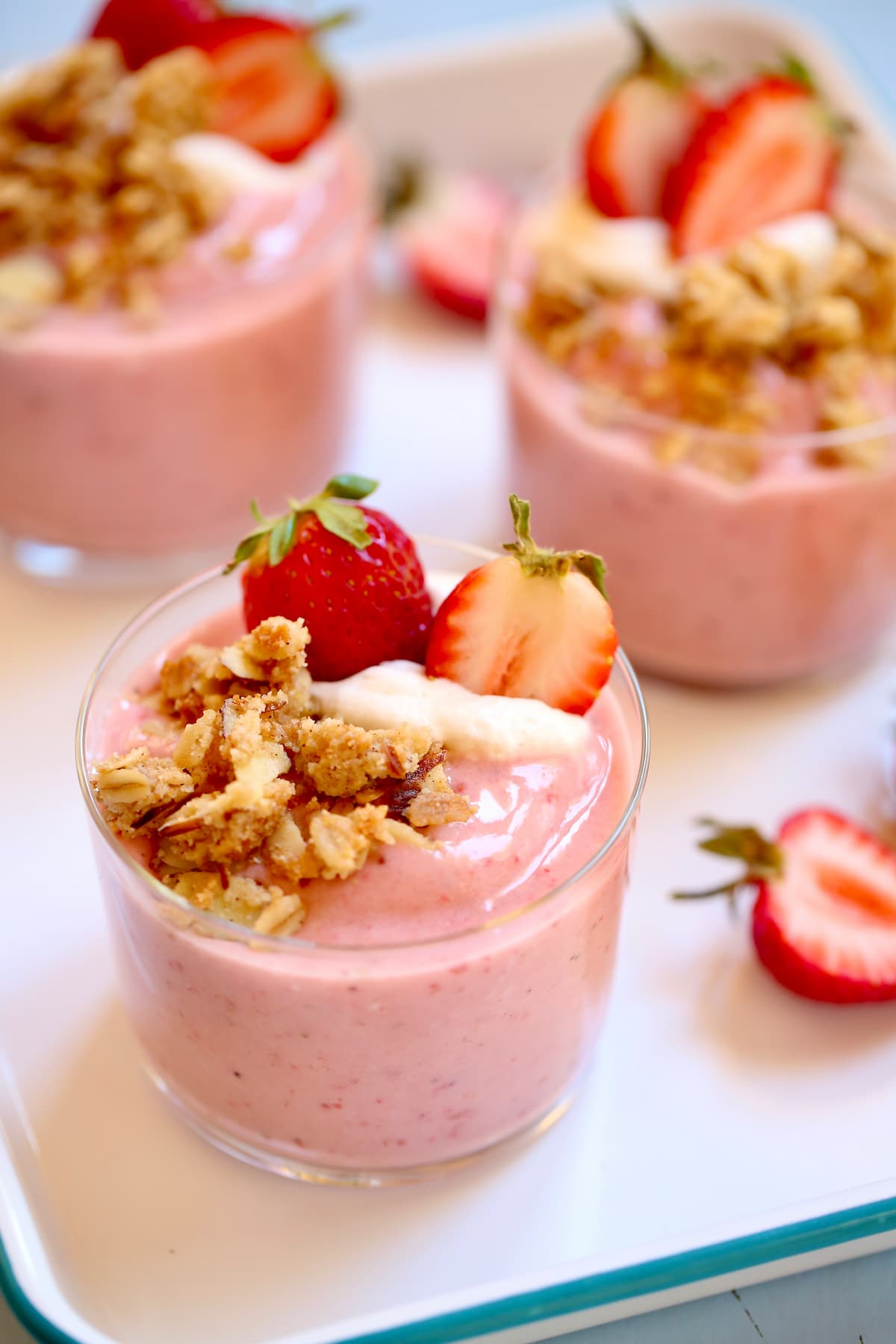 strawberry smoothies on a white tray, close up shot.