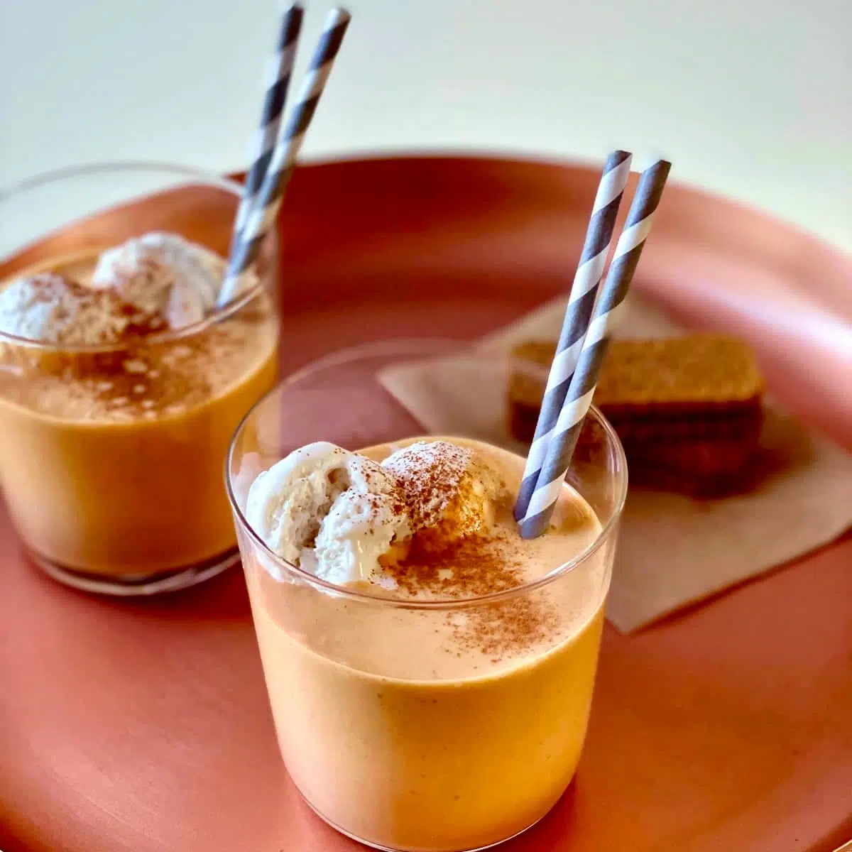 a tray of pumpkin spice milkshakes