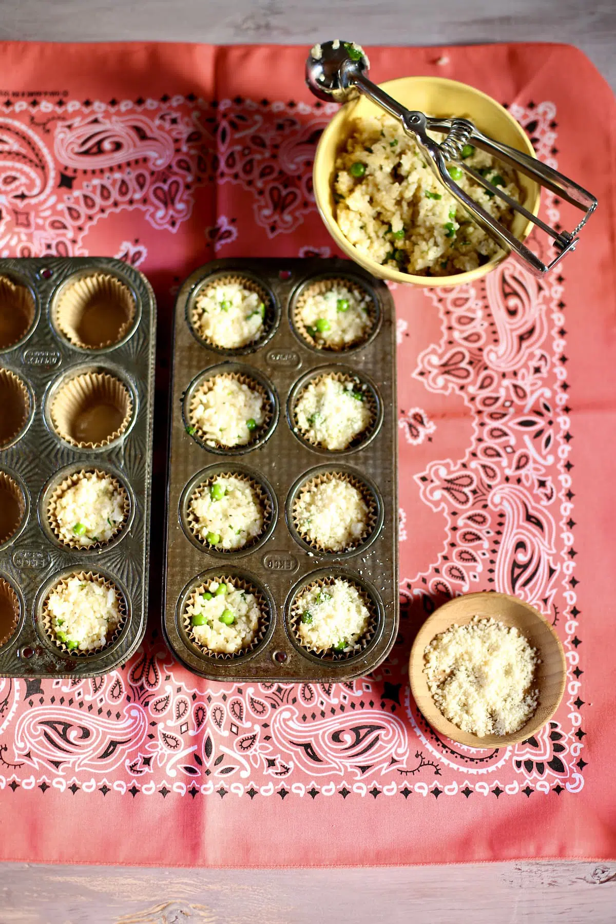 a tray of cauliflower appetizers are ready for the oven in a baking tray.
