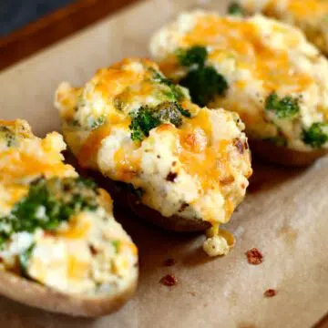 a close up photo of broccoli twice stuffed potatoes.