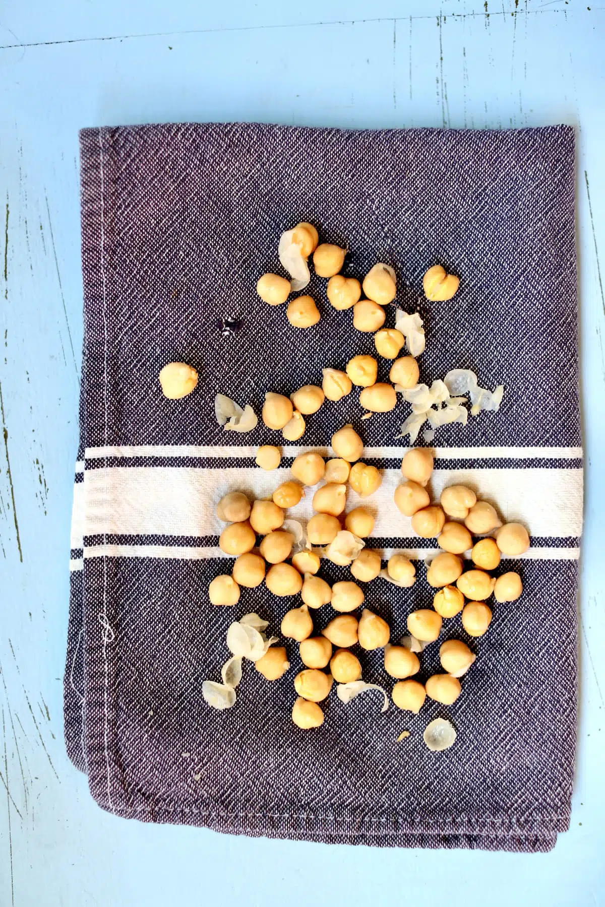 a gray dishtowel with chickpeas on it.