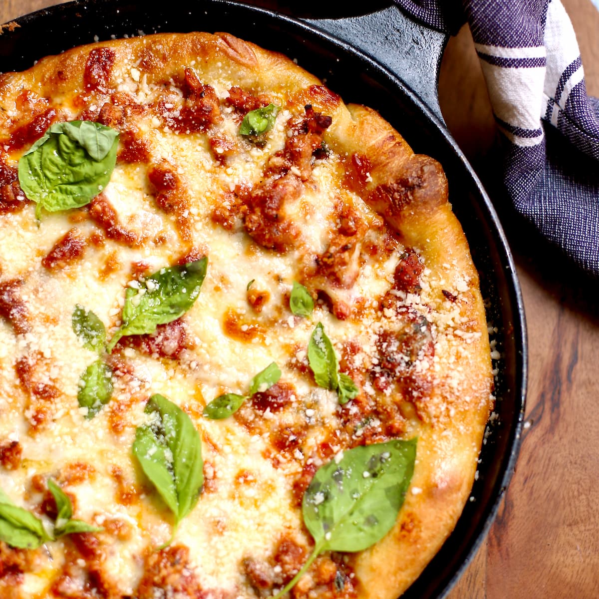 a skillet pizza in lodge cast iron.