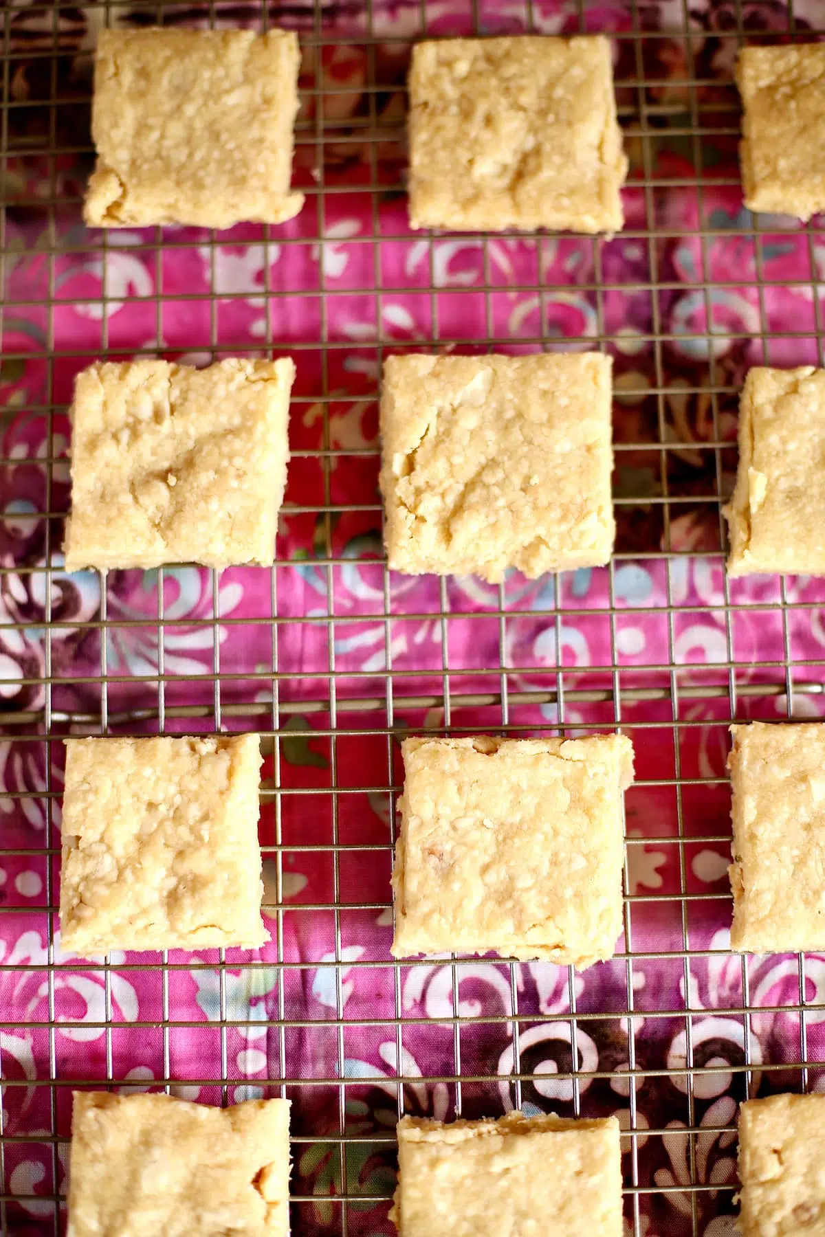 a tray of shortbread cookies on a wire rack.