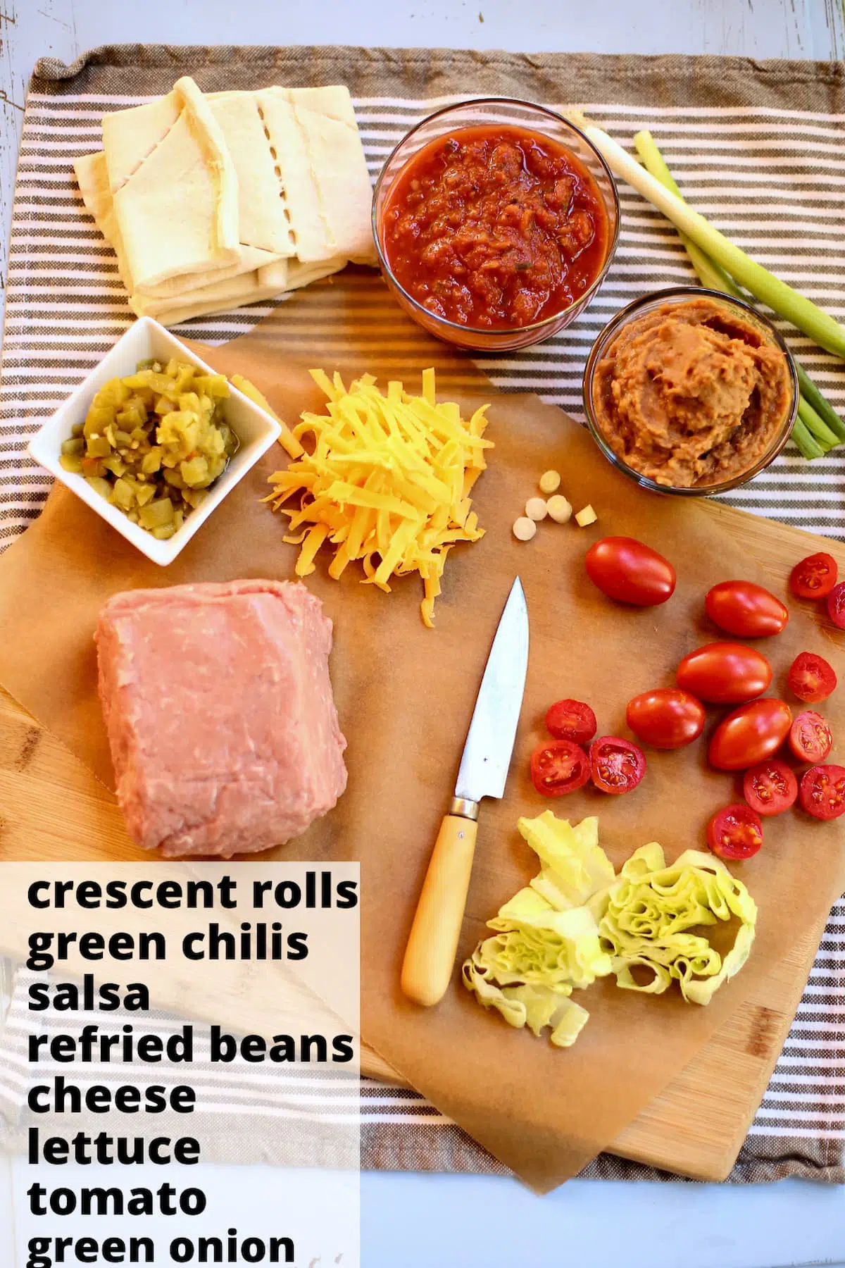 a table with ingredients, turkey, cheese, chiliss, tomatoes and more, with a text overlay of the names of the ingredients.