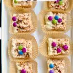 a tray of cereal treats with decorations and text overlay saying the recipe name.