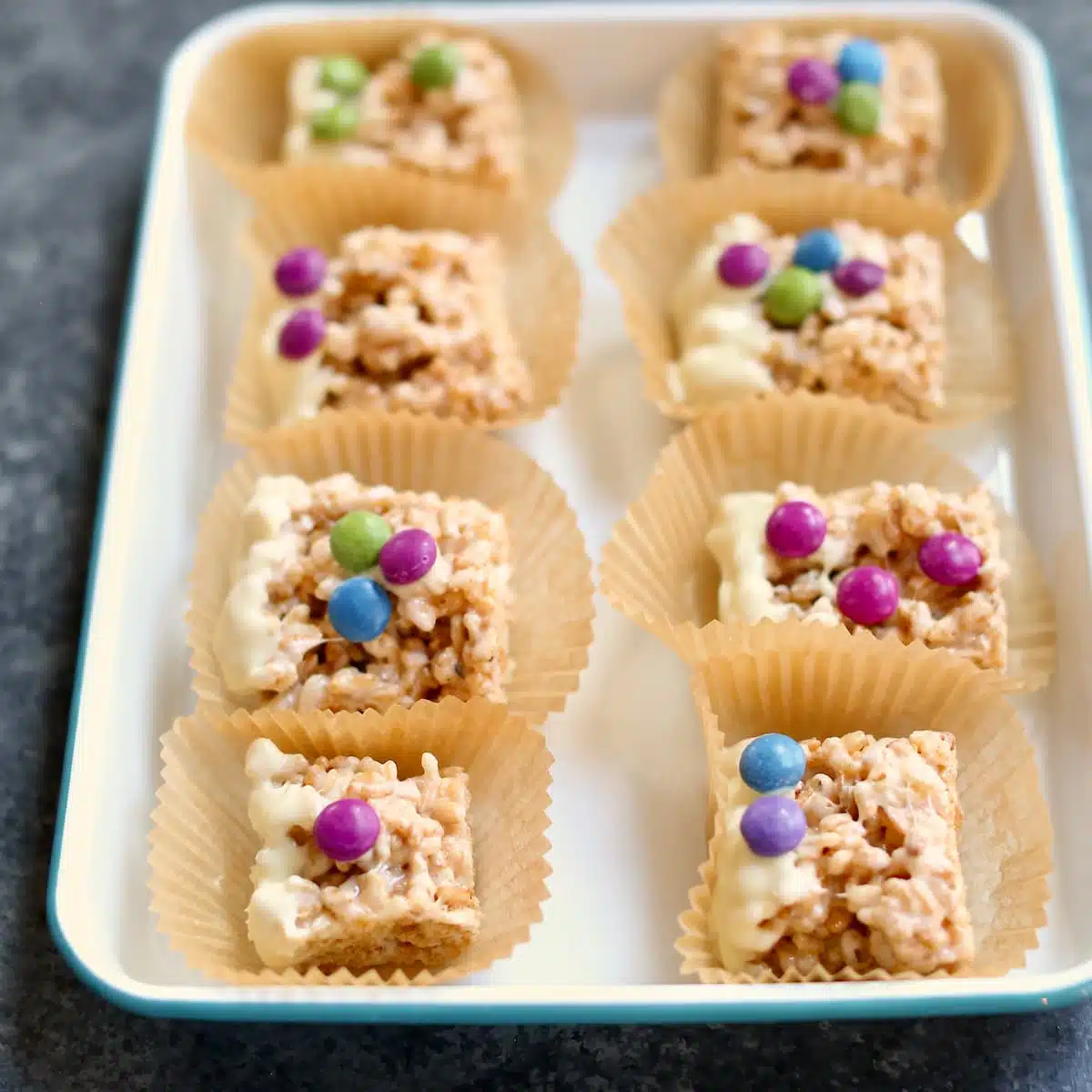 a square photo of rice krispie treats on a platter.