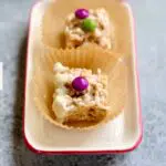 a tray of rice cereal treats on a tray with text overlay saying the name of the recipe.