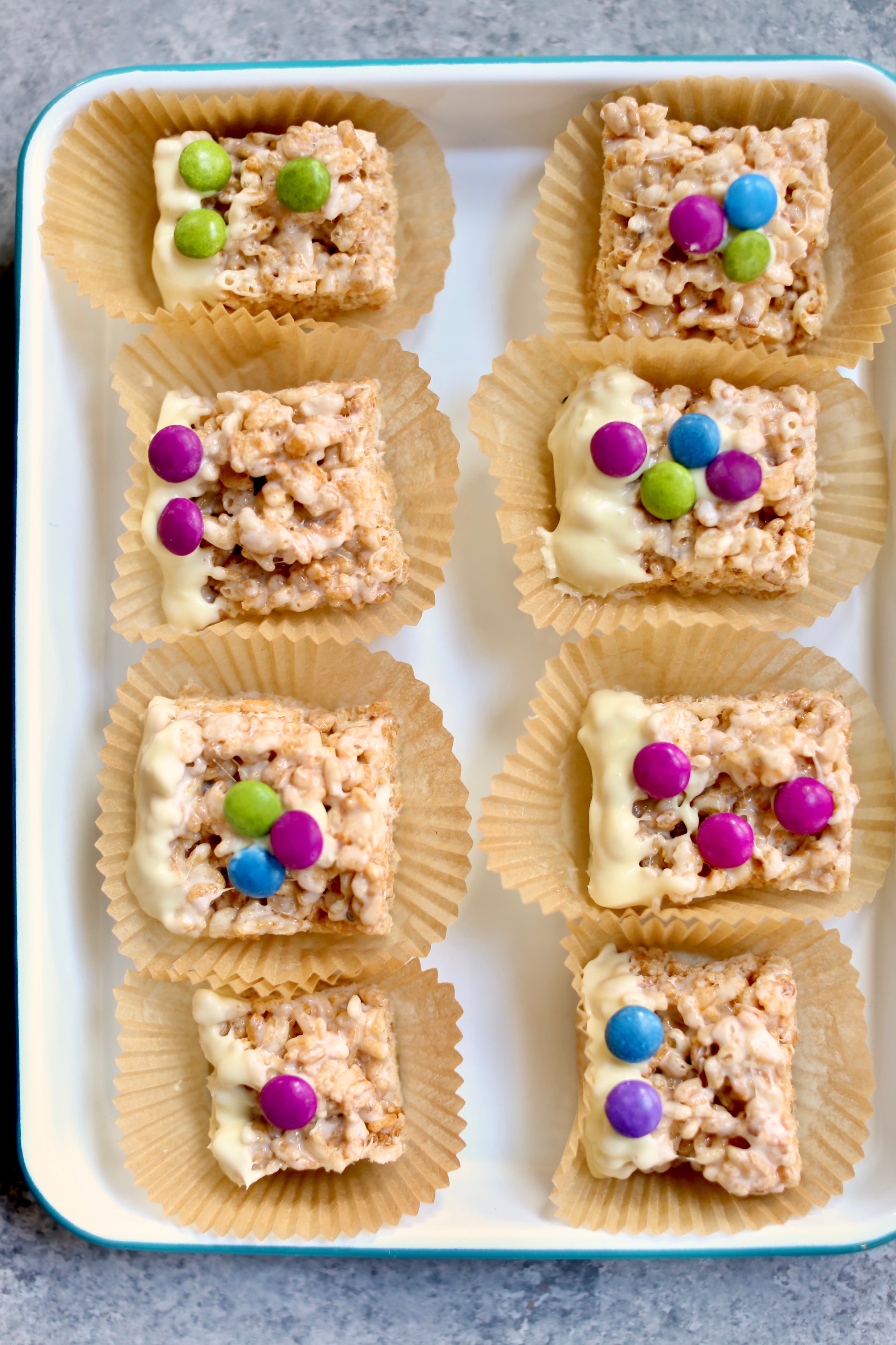 a tray of cereal treats with decorations on the top.