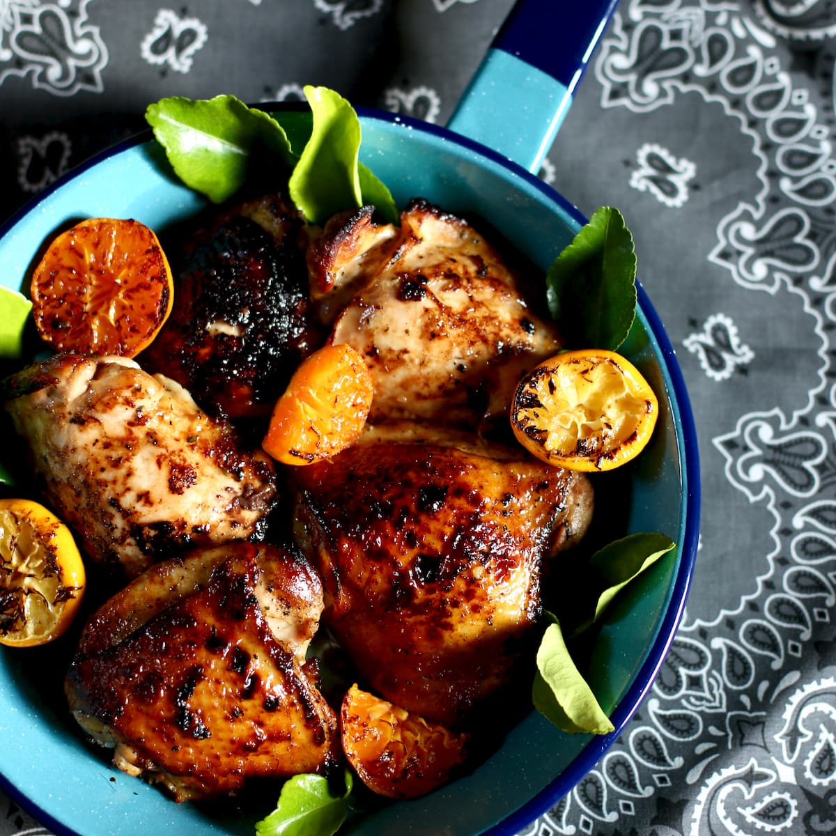 a blue skillet of pan seared chicken.