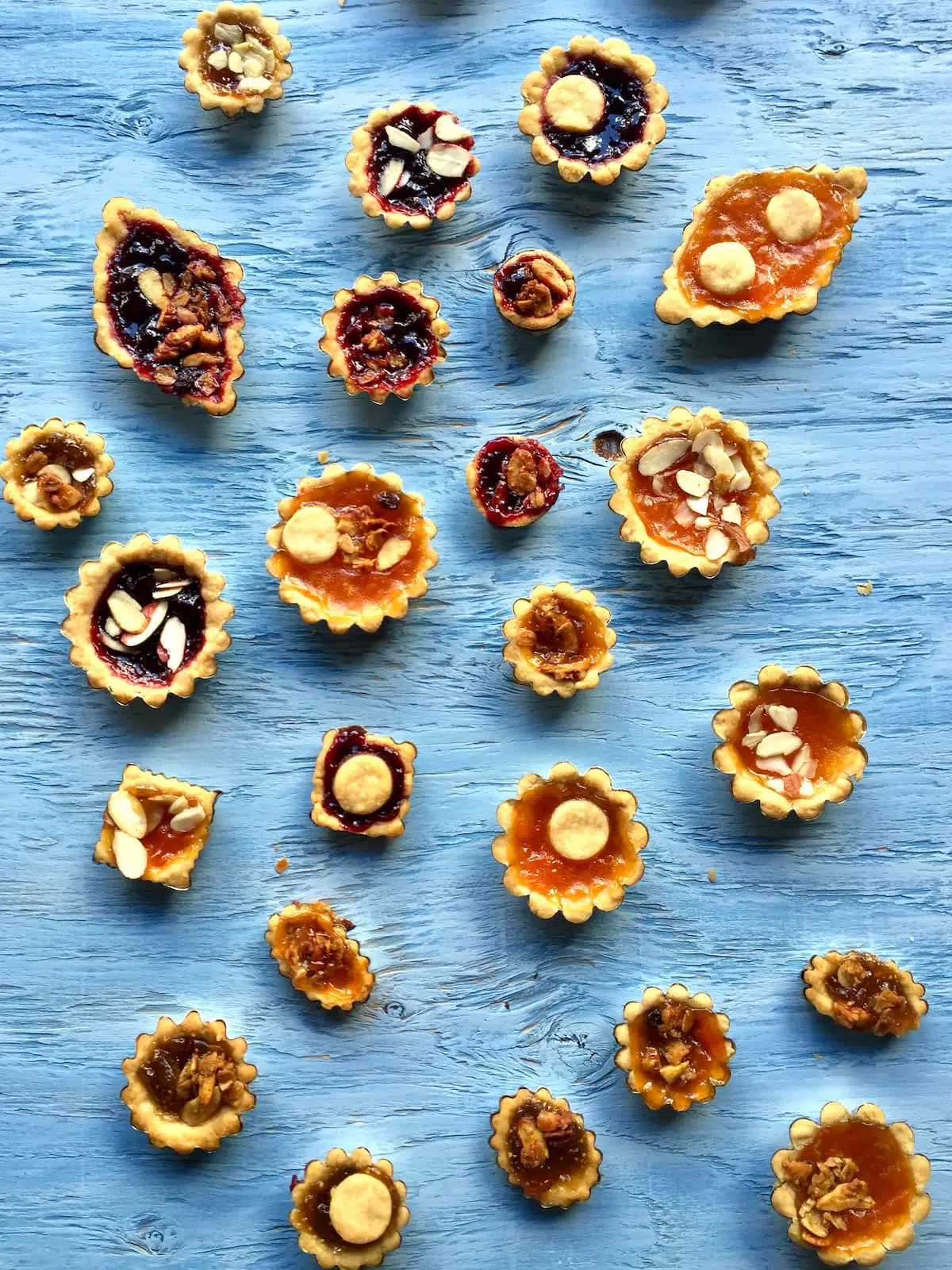 a photo of jam pies on a blue table.