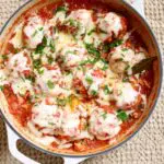 a skillet of cooked meatballs with melted cheese, and a text overlay saying the recipe name.