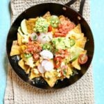 a skillet with breakfast nachos in it.