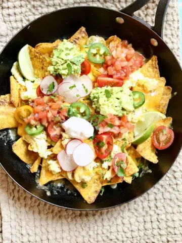 a skillet with breakfast nachos in it.