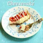 a blue background and small piece of cheesecake with a text overlay saying the recipe name.