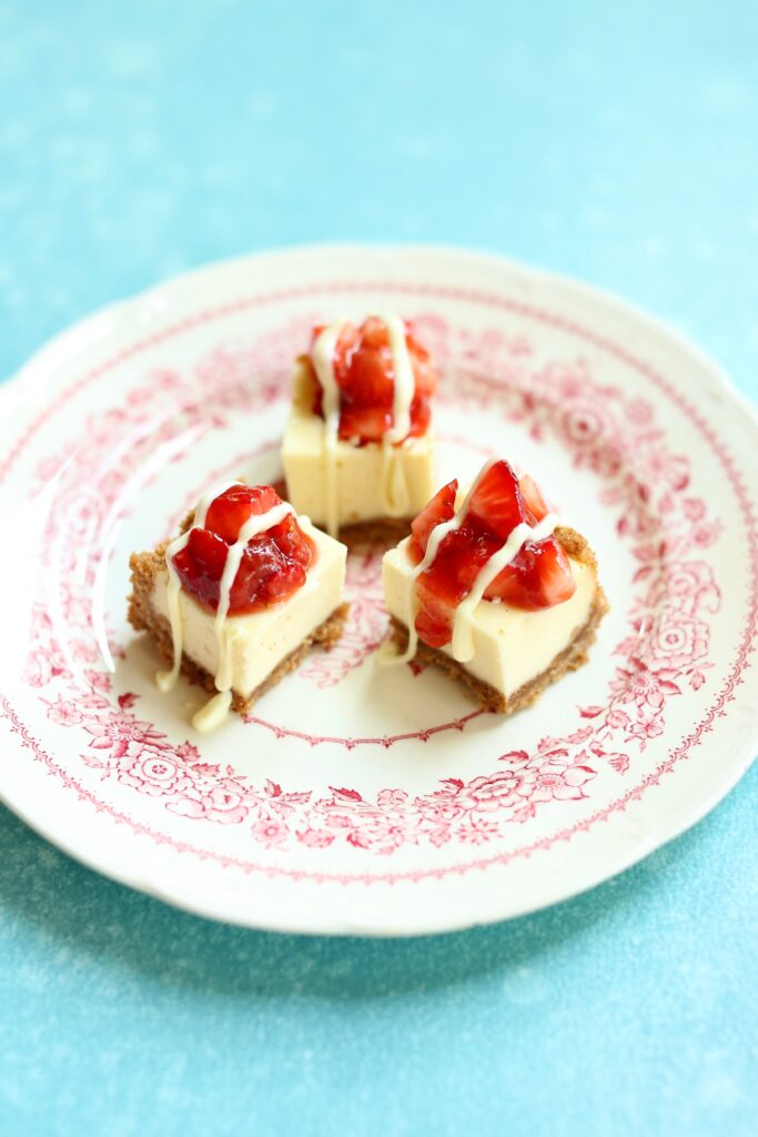 a small plate of cheesecake bites.