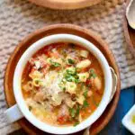 a bowl of soup with a text overlay saying the recipe name.