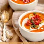 bowls of tomato soup with text overlay saying the recipe name.
