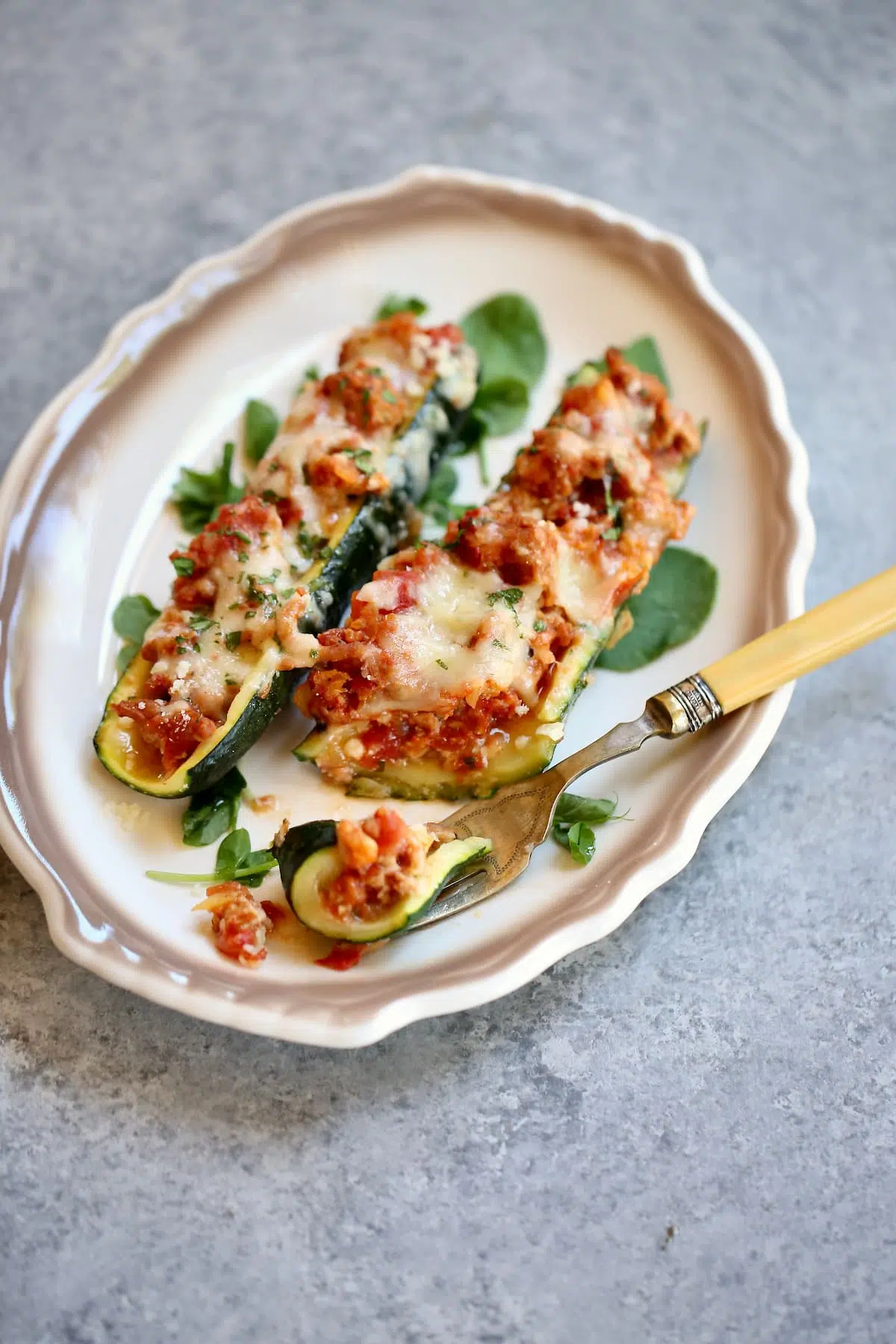 a side photo of stuffed zucchini.