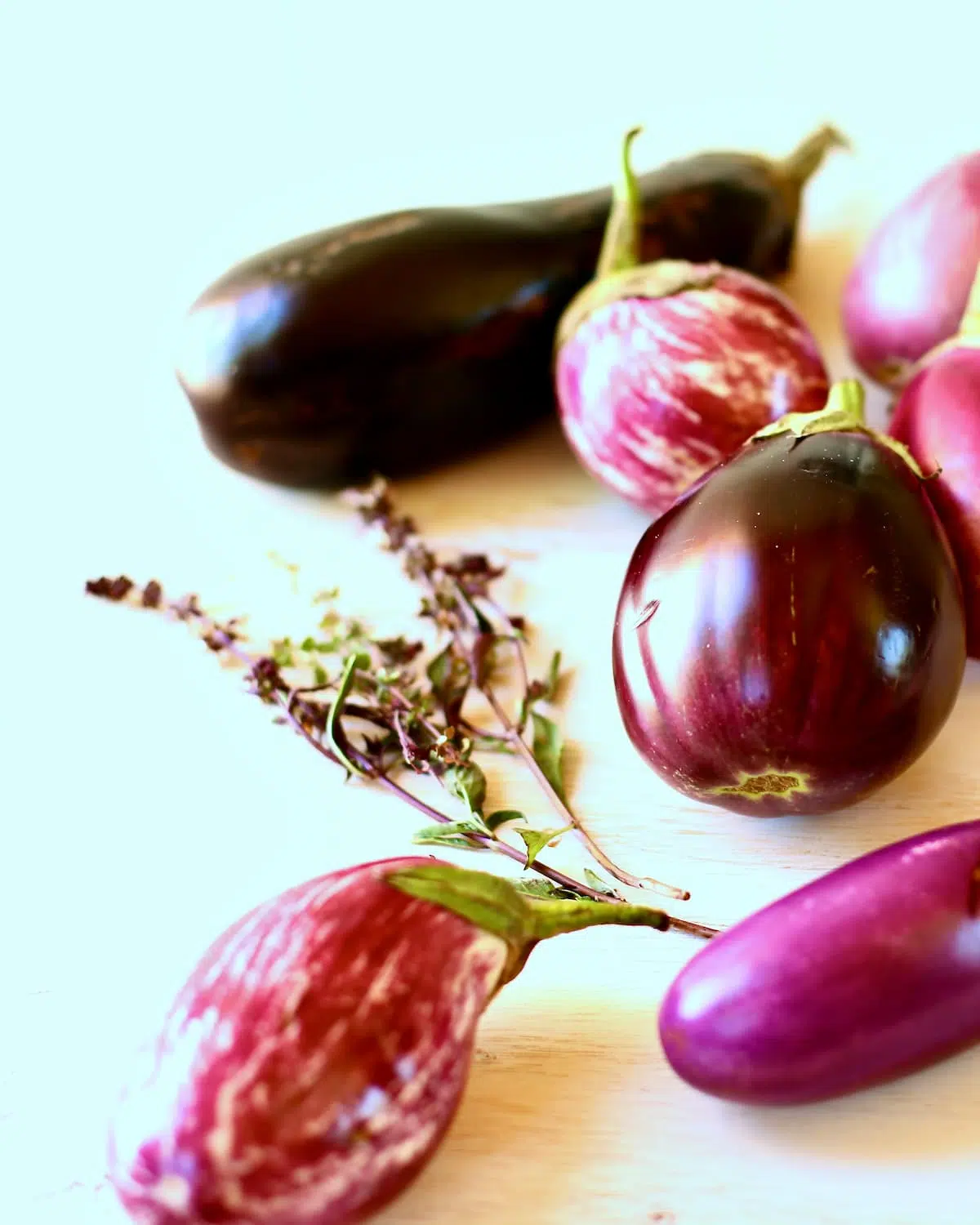 a table of mini eggplants.