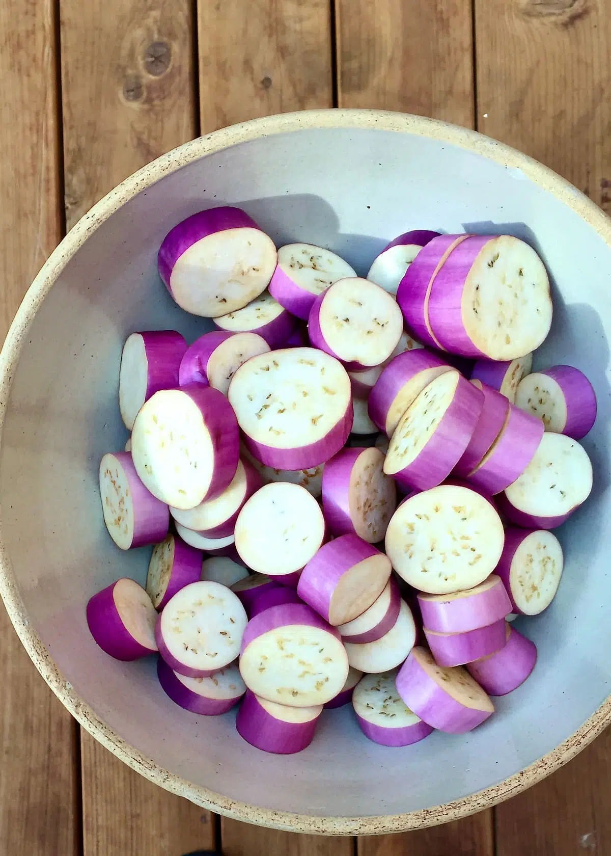 a bowl of uncooked eggplant.