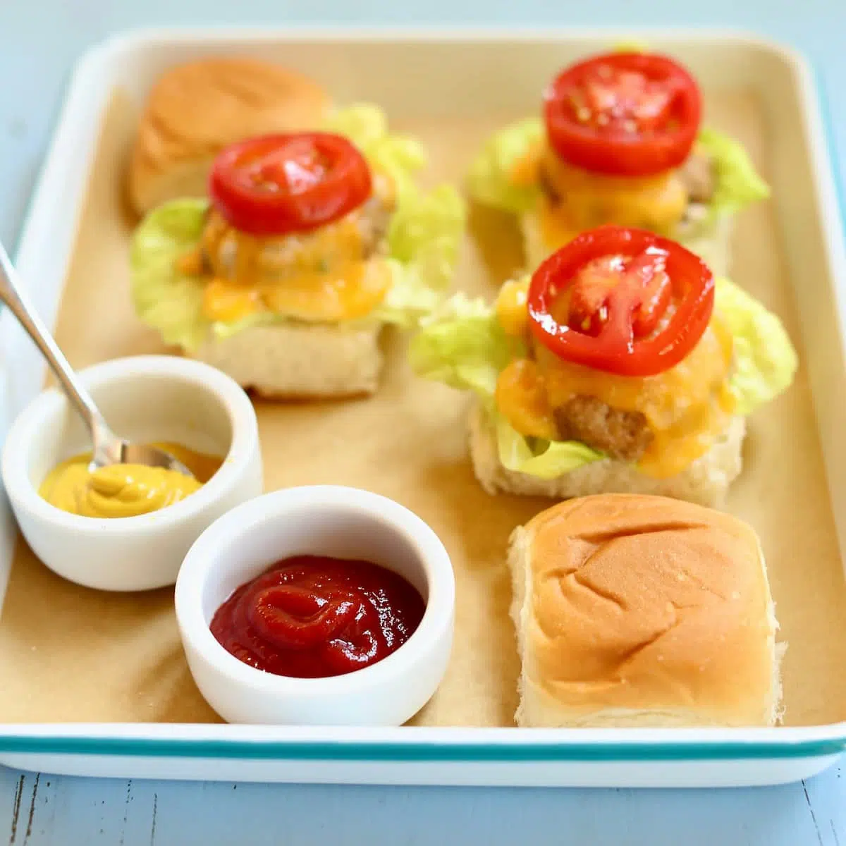 a tray of turkey burgers on a platter.