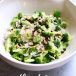a dish of broccoli salad in a white bowl with a text overlay saying the recipe name.