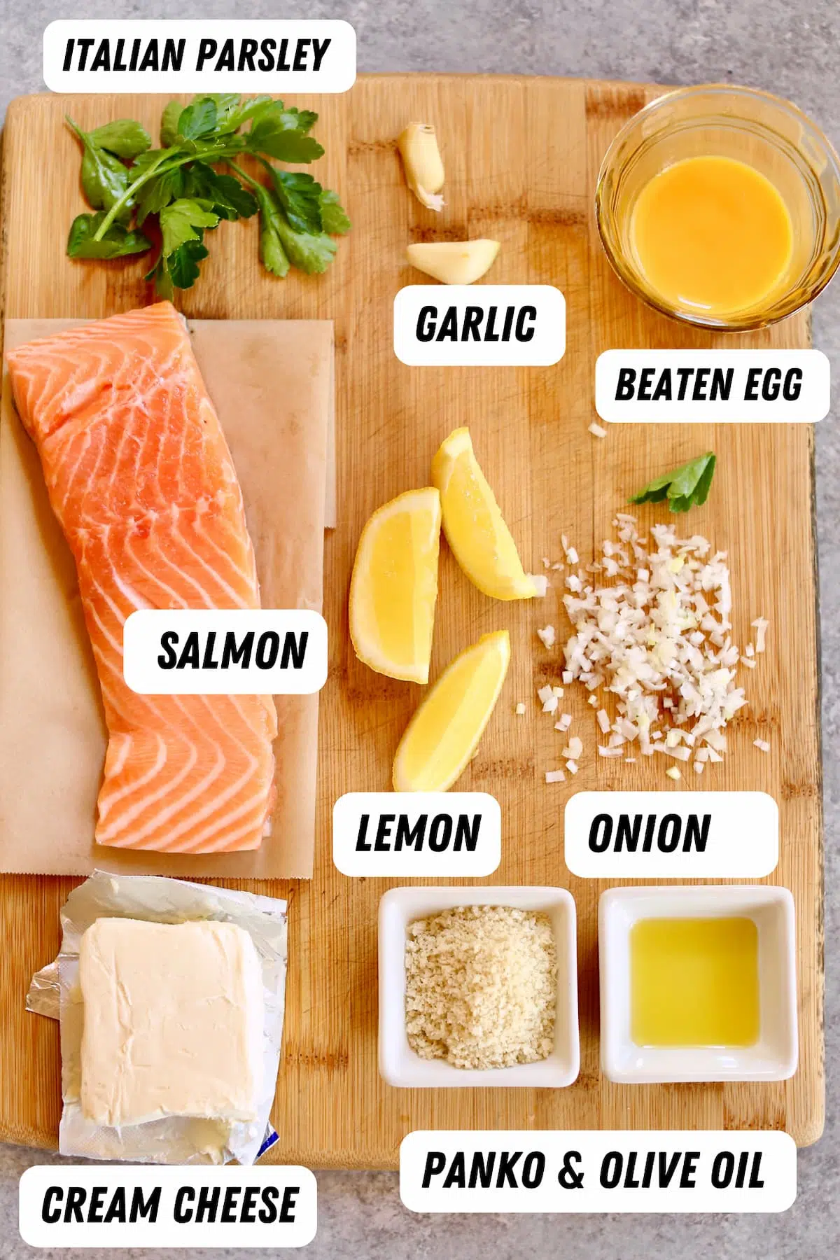 a wooden tray with ingredients for stuffed salmon
