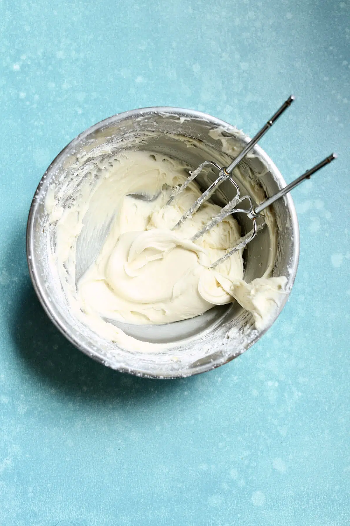 a bowl with frosting being made in it.