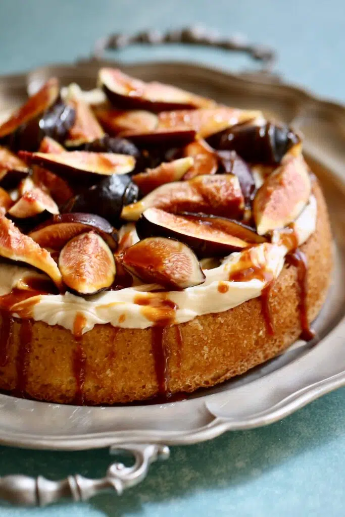 a very close up shot of a cake with figs on it.