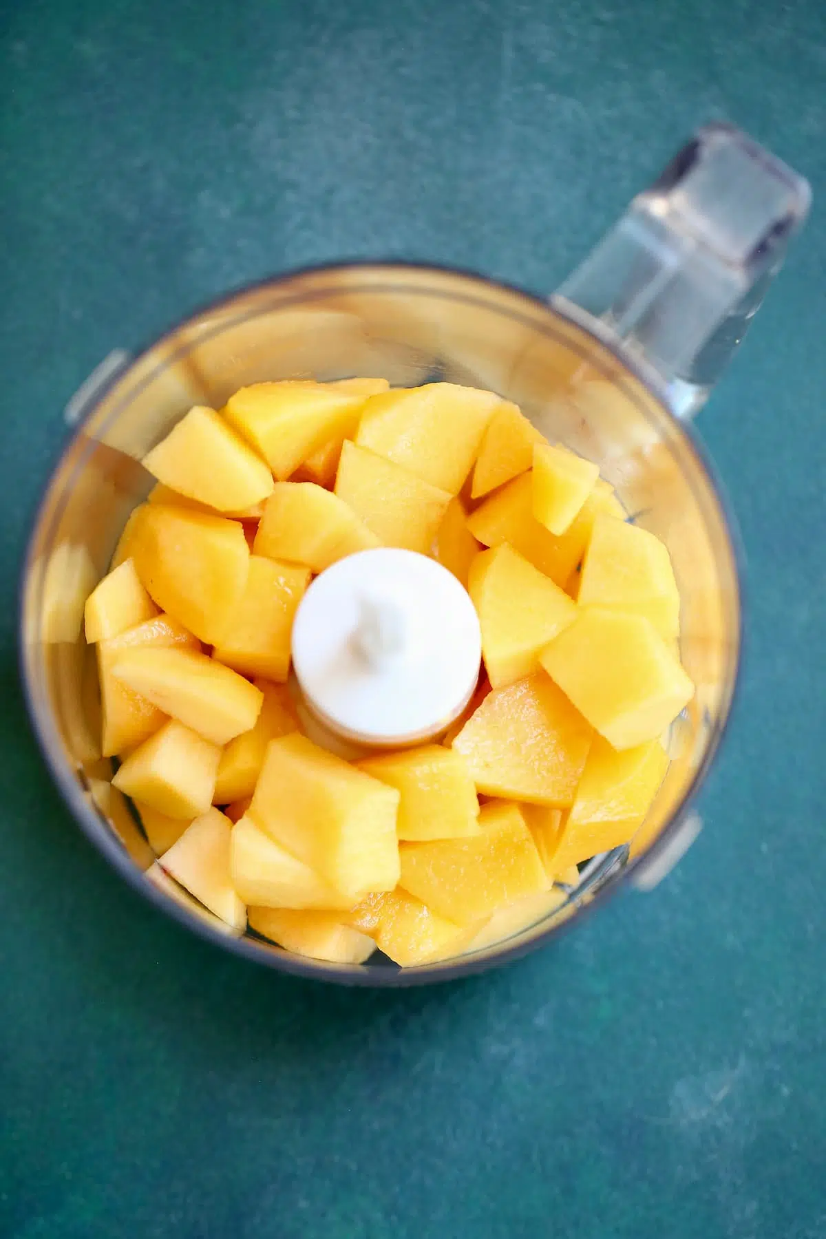 a container of peaches to be pureed.