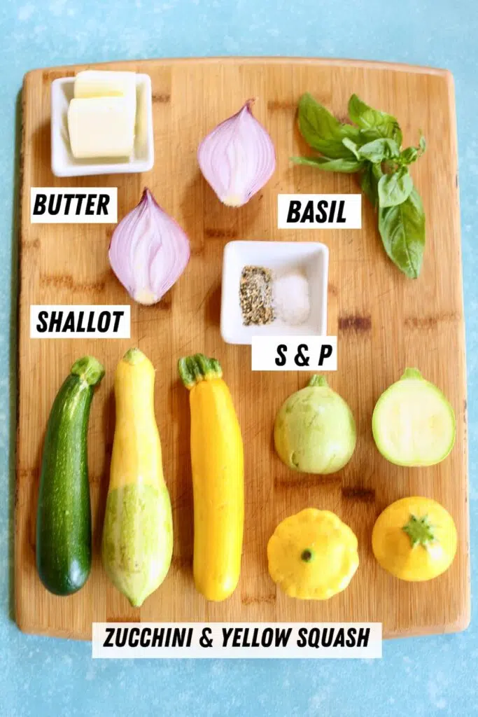 a cutting board with ingredients on it for sauteed zucchini.