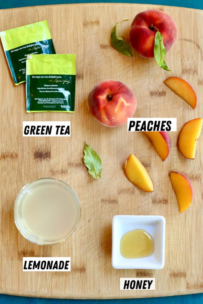 a board with ingredients to make peach iced tea.