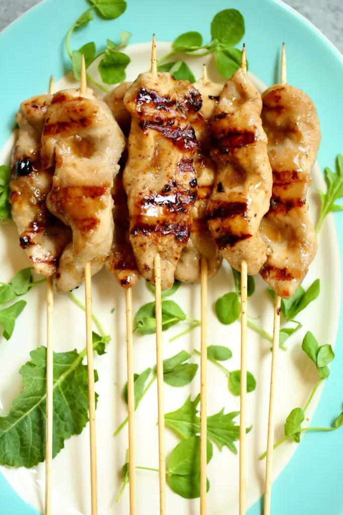 a tray of chicken skewers.