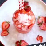 a white plate with ice and a strawberry drink in the middle.