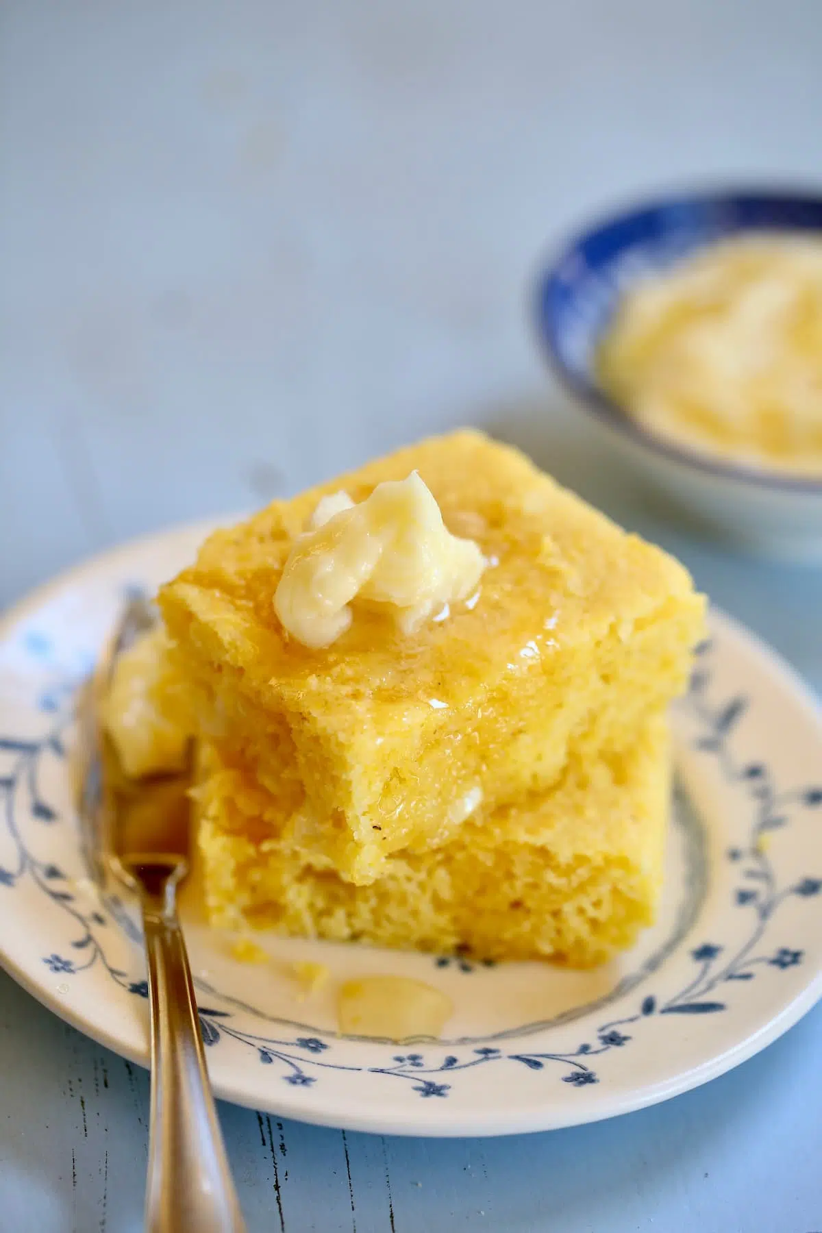 a plate with cornbread on it.  
