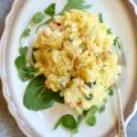 a small plate with potato salad on it.