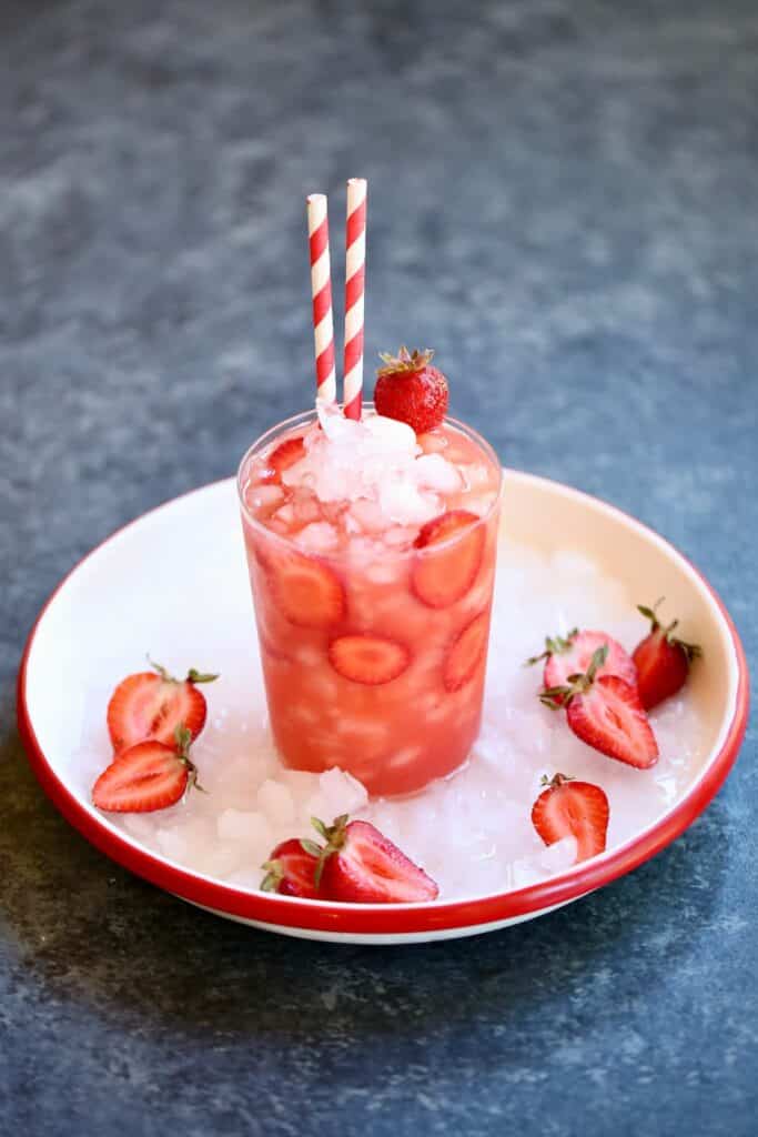 a tray with a strawberry drink on it.