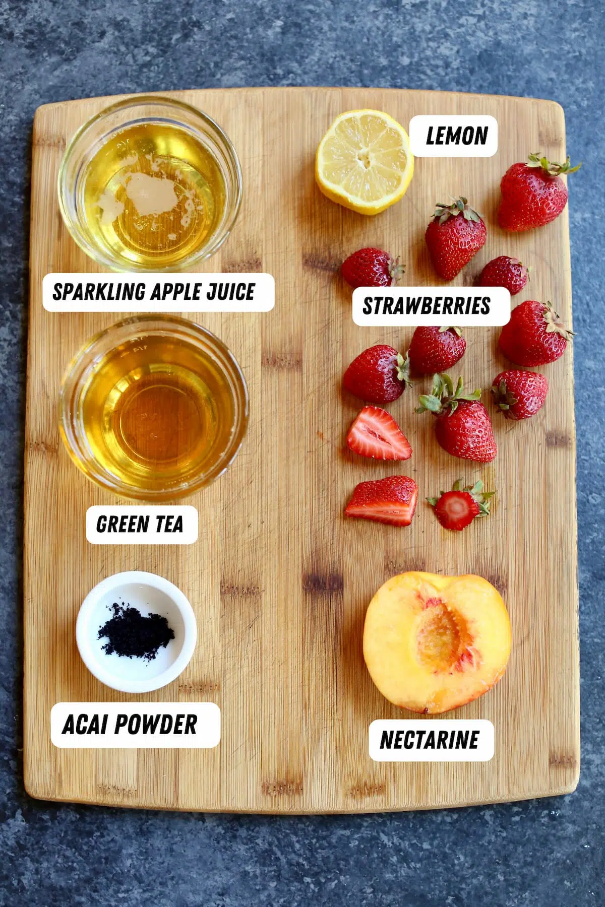 a cutting board of ingredients for a beverage.
