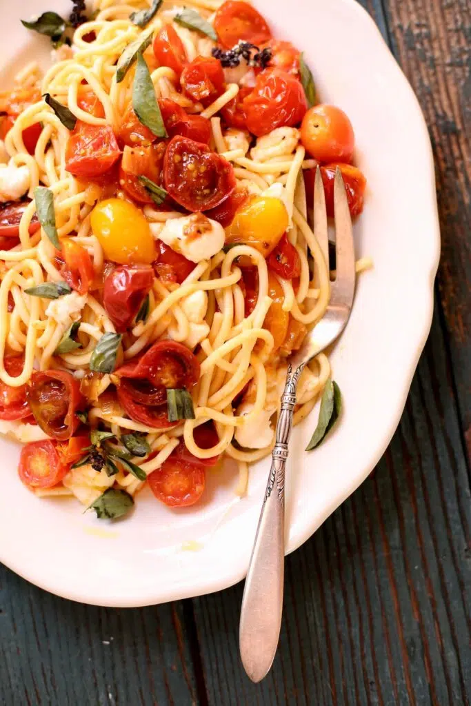 a plate of pasta on a white plate.