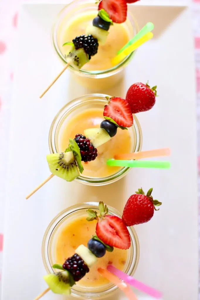 pineapple smoothies on a tray.