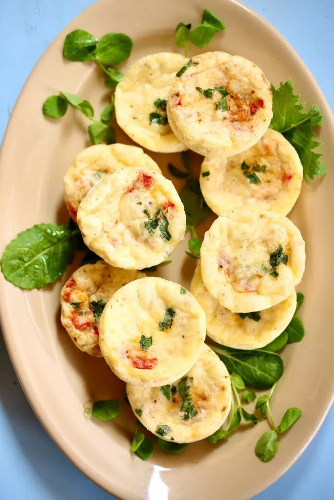 some egg white bites on a beige platter.